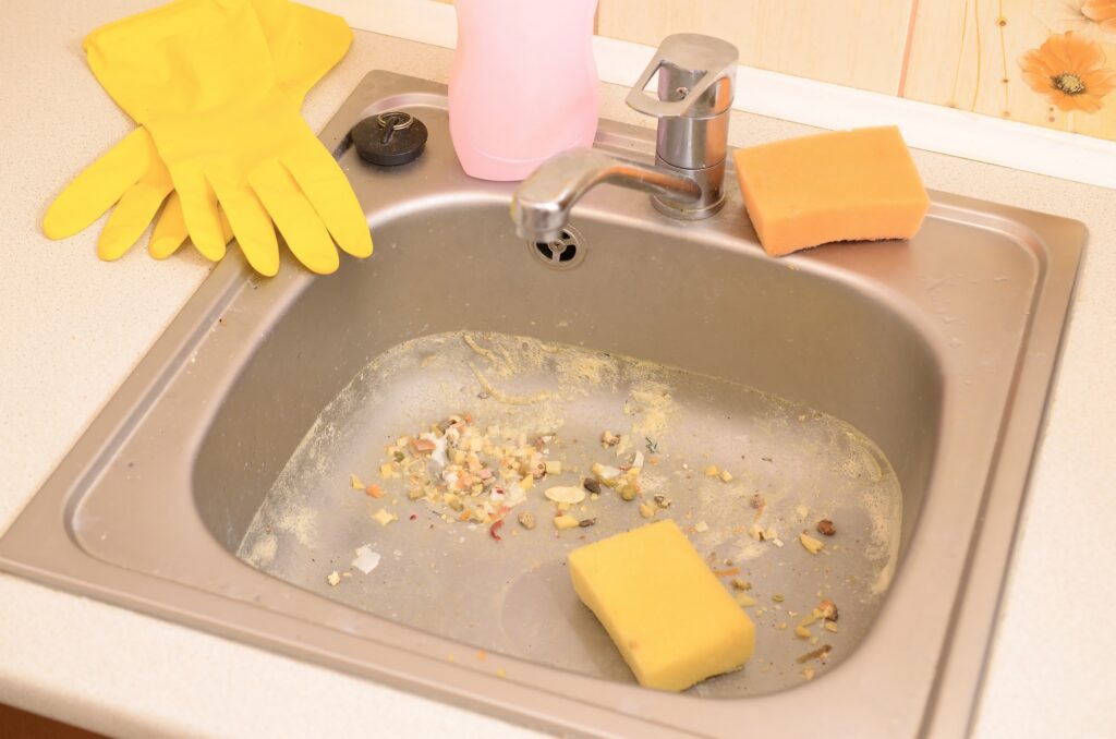 Close up on dirty clogging kitchen sink drain