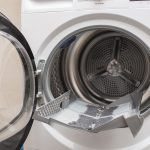 cleanup lints and dirt from tumble dryer filter. Clothes dryer lint filter that is covered with lint