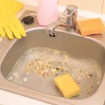 Close up on dirty clogging kitchen sink drain