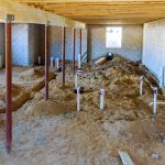 Installing sewer pipe in the ground basement mount a new pipe on the floor